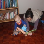 Trying to read to Nicky while he plays with his wrapping paper.