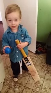 toddler with bat and ball
