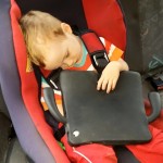 toddler sleeping in the car with IPad