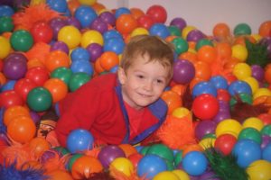 kid in ball pit