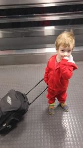 kid pulling suitcase