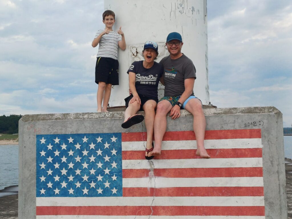 family and flag at Lake Michagan